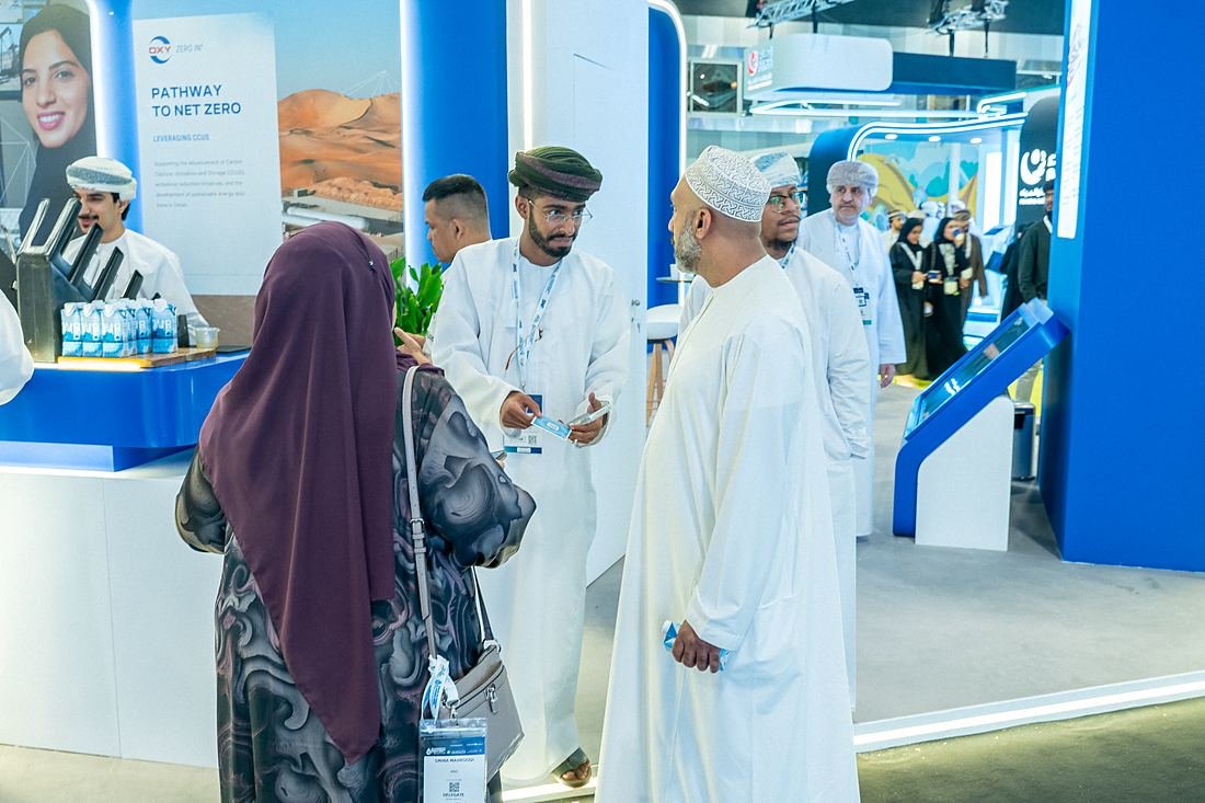 Guests in conversation beside the OURWATER display