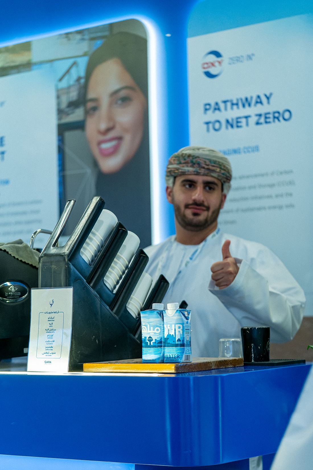 OURWATER carton bottles chilled and ready on a service counter